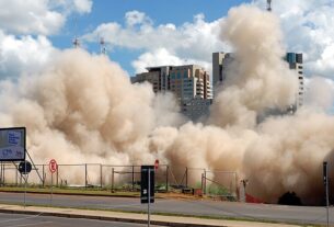 A building implodes