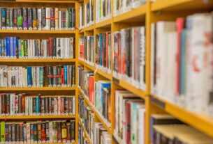 A corner of bookshelves filled with paperback books